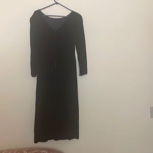 Black velvet holiday dress long sleeves,deep V back.midi.